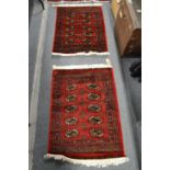 Two small Bokara rugs 90cm x 66cm and 95cm x 66cm.