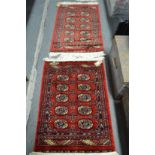 Two small Bokara rugs 95cm x 67cm and 105cm x 63cm.