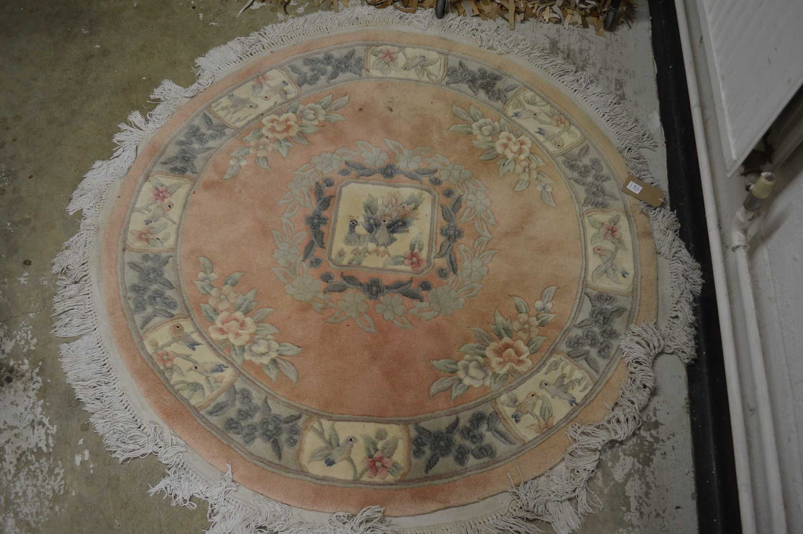 A Chinese circular rug 130cm diameter.