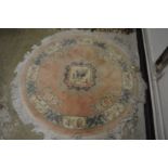 A Chinese circular rug 130cm diameter.