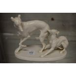 After P J Mene, a porcelain model of two whippets.