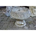 An Art Nouveau style composite circular pedestal garden planter.