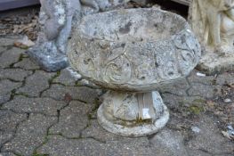 An Art Nouveau style composite circular pedestal garden planter.