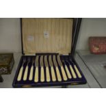 A cased set of fruit knives and forks.