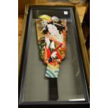 An unusual framed and glazed Japanese fan shaped display of a geisha together with a pair of folding