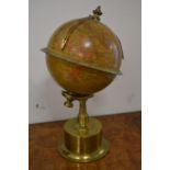 A good small rotating brass globe clock.