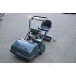 A good large Atco 24" cut petrol cylinder lawn mower complete with seat and roller.