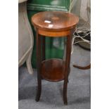 An Edwardian inlaid mahogany two tier jardiniere stand.