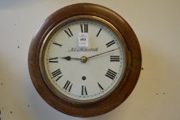 A small mahogany cased circular wall clock with 7.5 inch dial.