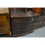A mahogany serpentine fronted four drawer chest.