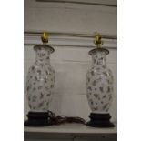 A pair of Chinese style famille rose table lamps.