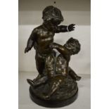 A good bronze group of three playful cherubs, appears unsigned.