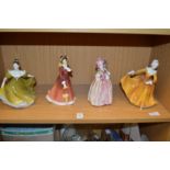 Four Doulton figurines.