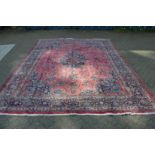 A modern crimson ground Bokara rug 200cm x127cm.