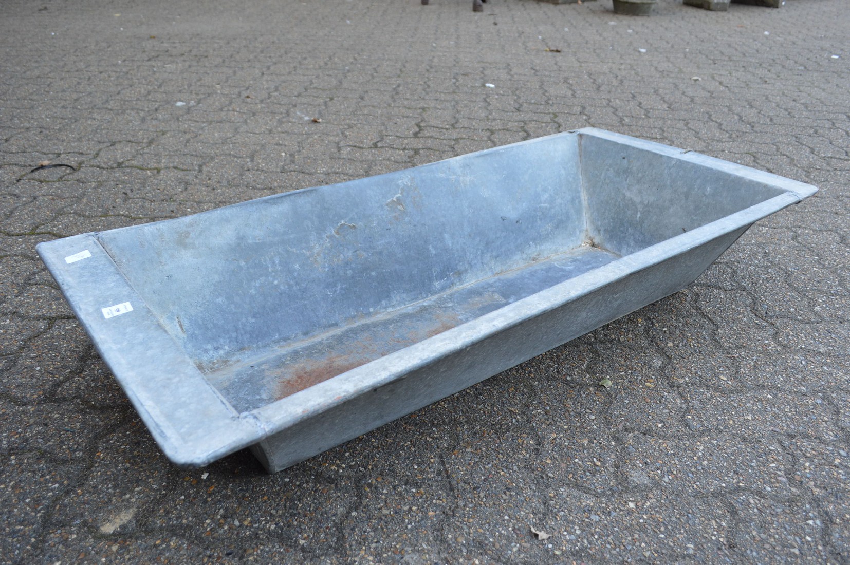 A galvanised rectangular planter/trough.