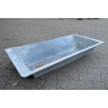 A galvanised rectangular planter/trough.