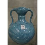 A Chinese turquoise glazed twin handled pottery vase.