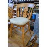 A set of eight beech kitchen chairs.