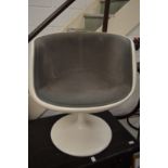 A stylish fibreglass swivel chair.