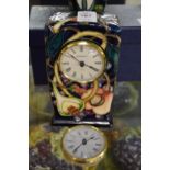 A Moorcroft mantle clock and a spare movement.