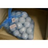 A bag of fifty Titleist golf balls.