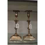 A pair of Sheffield plated candlesticks.