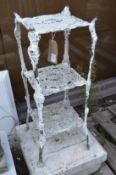A white painted aluminium three tier plant stand.