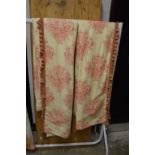 A pair of curtains, cream ground with stylised flower and vase decoration, each 210cm drop x 135cm