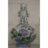 A Chinese peach decorated bottle vase (rim damaged).