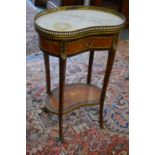 A French ormolu and marble top mahogany two tier single drawer kidney shaped occasional table.