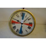 A brass circular ships clock with 10 inch dial.