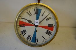 A brass circular ships clock with 10 inch dial.