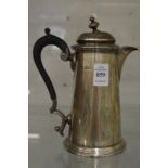 A silver hot water jug.