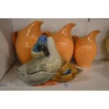 A duck and drake pottery tureen and cover and three jugs.