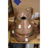 A copper half gallon jug and a copper tray.