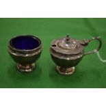 A silver mustard pot and matching salt.