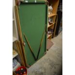 A 4' 6" snooker table with leg assembly and accessories.