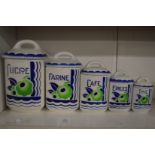 Graduated set of five French porcelain storage jars.