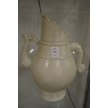 A Chinese buff glazed pottery ewer.