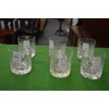 A set of six cut glass whisky tumblers.