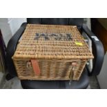 A Fortnum and Mason wicker hamper (lacking contents).