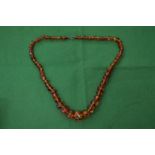 An amber bead necklace.