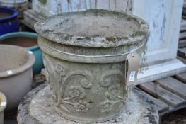 A composite garden planter (rim damaged).