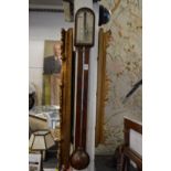 A George III mahogany stick barometer, the silvered dial signed Jas Lione, London.