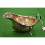 A silver sauce boat.