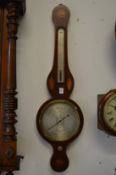 An inlaid mahogany cased aneroid barometer and thermometer, the silvered dial signed F Molton,