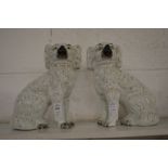 A pair of Staffordshire spaniels.