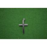 A stainless steel crucifix pendant.