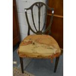 A decoratively painted shield back dining chair.