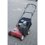 A Mountfield petrol garden lawn scarifier.